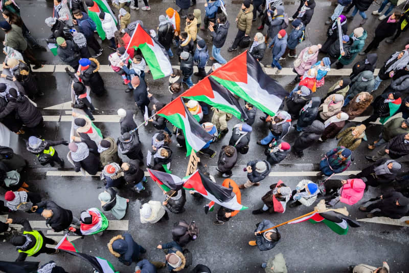 People take part in a demonstration in solidarity with the Palestinian people amid the ongoing conflict between Israel and Hamas. Christoph Soeder/dpa